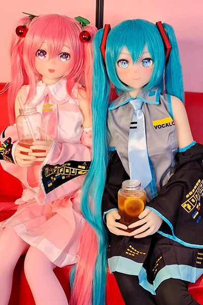  two anime dolls sitting