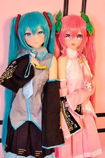  two anime dolls stand together